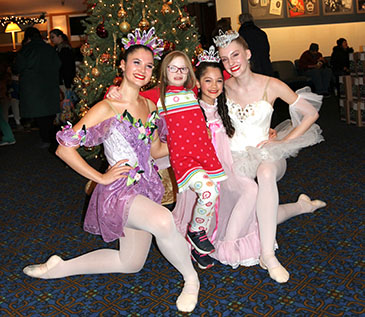 Some of the New Paltz Ballet Company’s dancers pose with a young friend of ThinkDIFFERENTLY in the lobby of the Bardavon in front of a ThinkDIFFERENTLY feather flag. This performance was a partnership with Dutchess County Tourism, Art Mid-Hudson, the Bardavon 1869 Opera House and ThinkDIFFERENTLY. 12/9/22