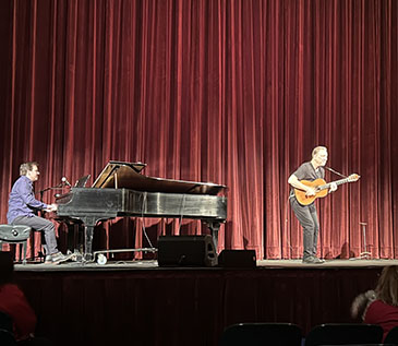 David Gonzalez performed “Cuentos- Tales from the Latino World” at the Bardavon, in partnership with Art Mid-Hudson and Dutchess County Tourism. To the left of the picture is Daniel Kelly, pianist, with David on the right (or mid stage) playing the guitar as part of his performance. 3/16/23.