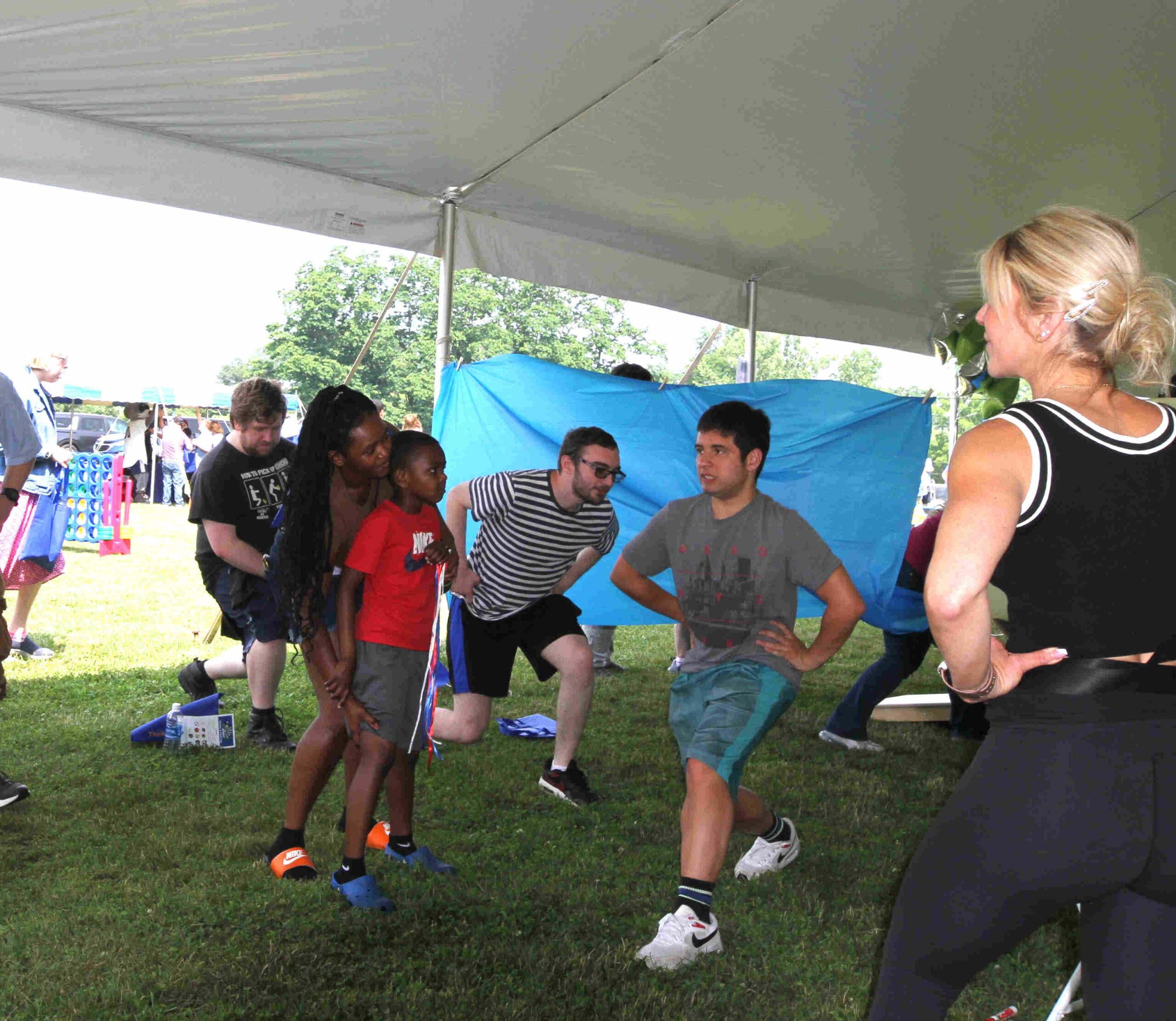 Eight Individuals of all ages participate in Autism Directory Services’ Moving Pieces exercise class at the 3rd Annual ThinkDIFFERENTLY Fitness & Field Day on Friday June 29, 2023 at Bowdoin Park.