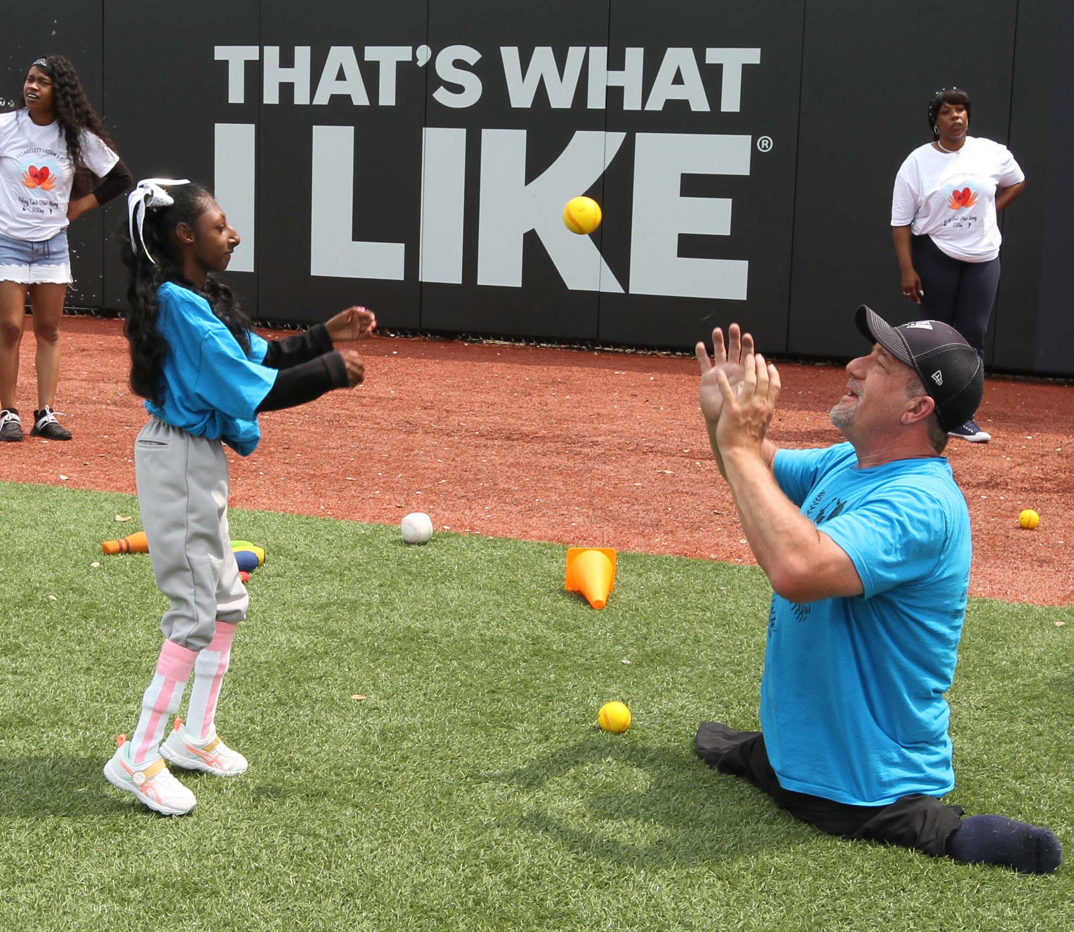 Sweet P and Dave Stevens play catch on the field! Disability, Dream and Do (also known as D3 Day) at Heritage Financial Field, June 17, 2023