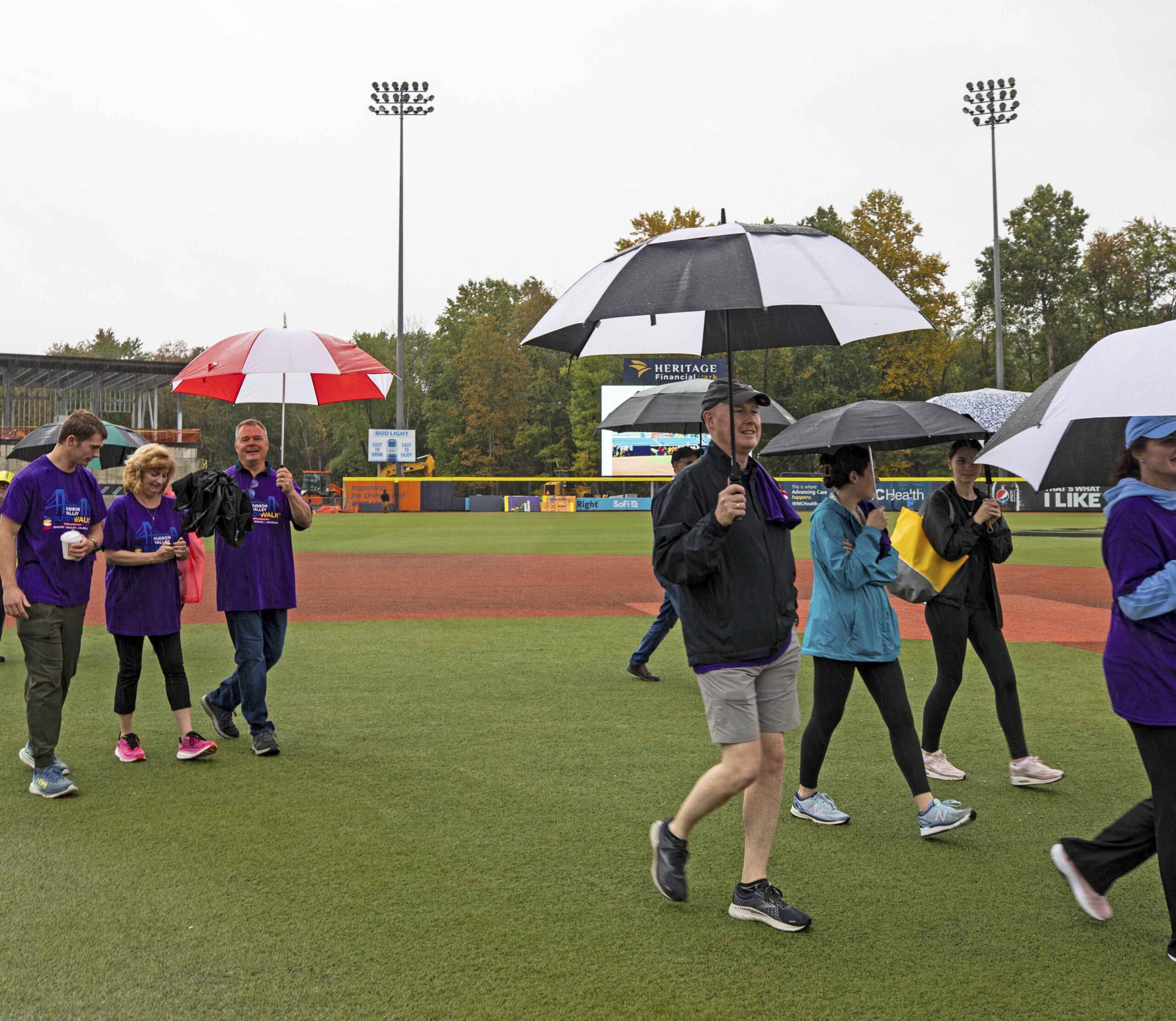 Families & friends walk rain or shine on the infield of the Heritage Financial Park for the Down Syndrome Associations Buddy Walk on Saturday October 7, 2023!